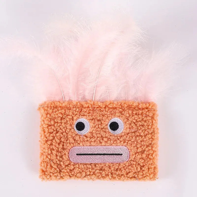 Colourful plush cat toy shaped like an explosion head with a big open mouth, shown in blue.