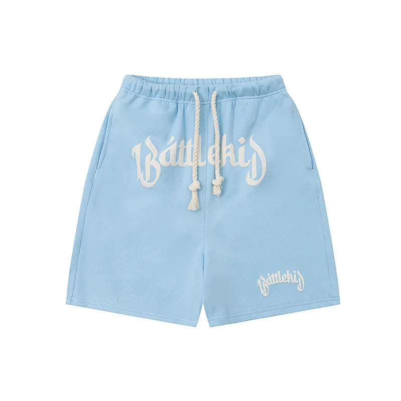 Loose-fit cropped sweatpants-style hip hop shorts in cotton blend fabric on a neutral background