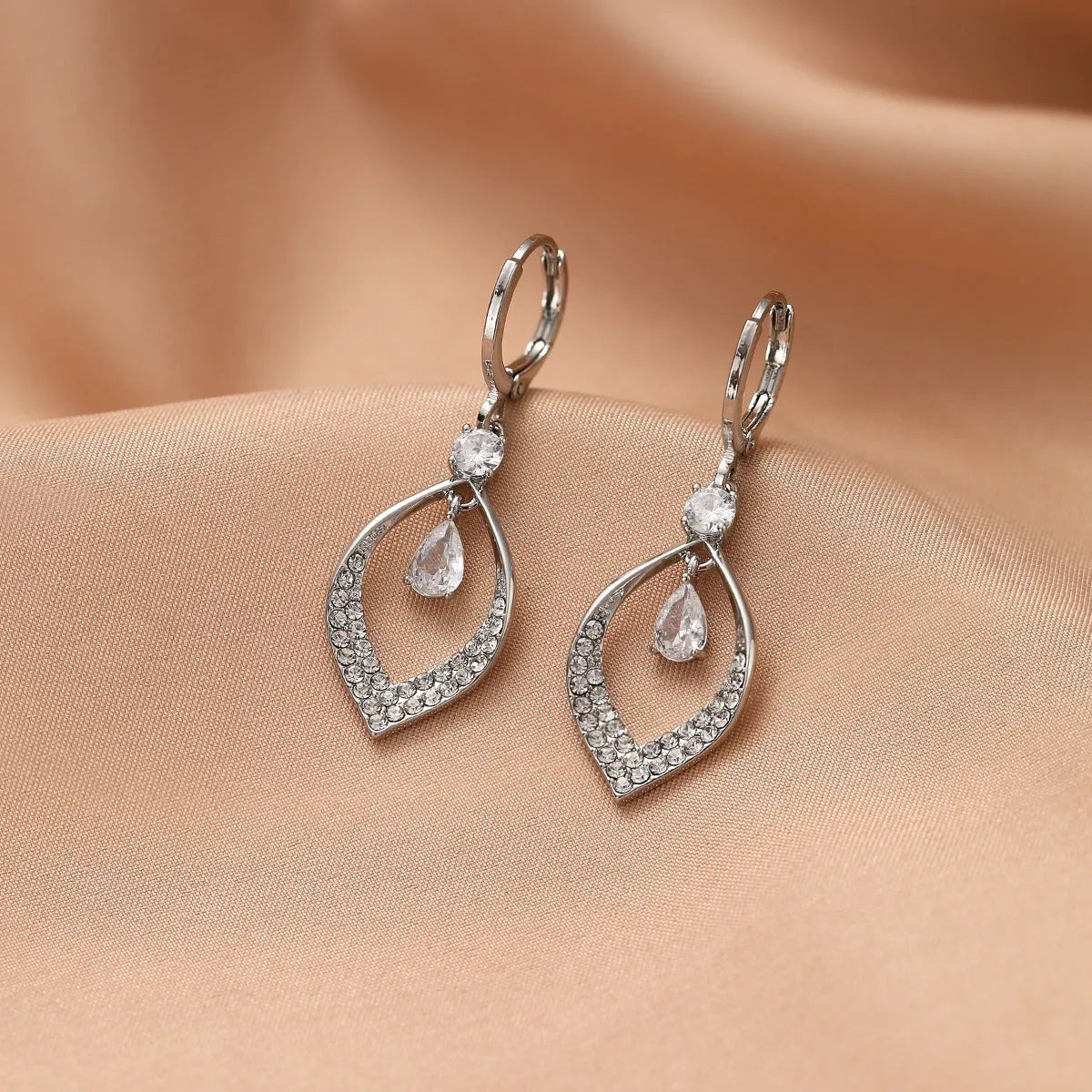 Women's copper water drop tassel earrings with a choice of gold or silver thickened buckles.