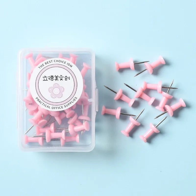 Plastic push pins in cherry blossom pink, mint green, and lavender colours showing large and small size options