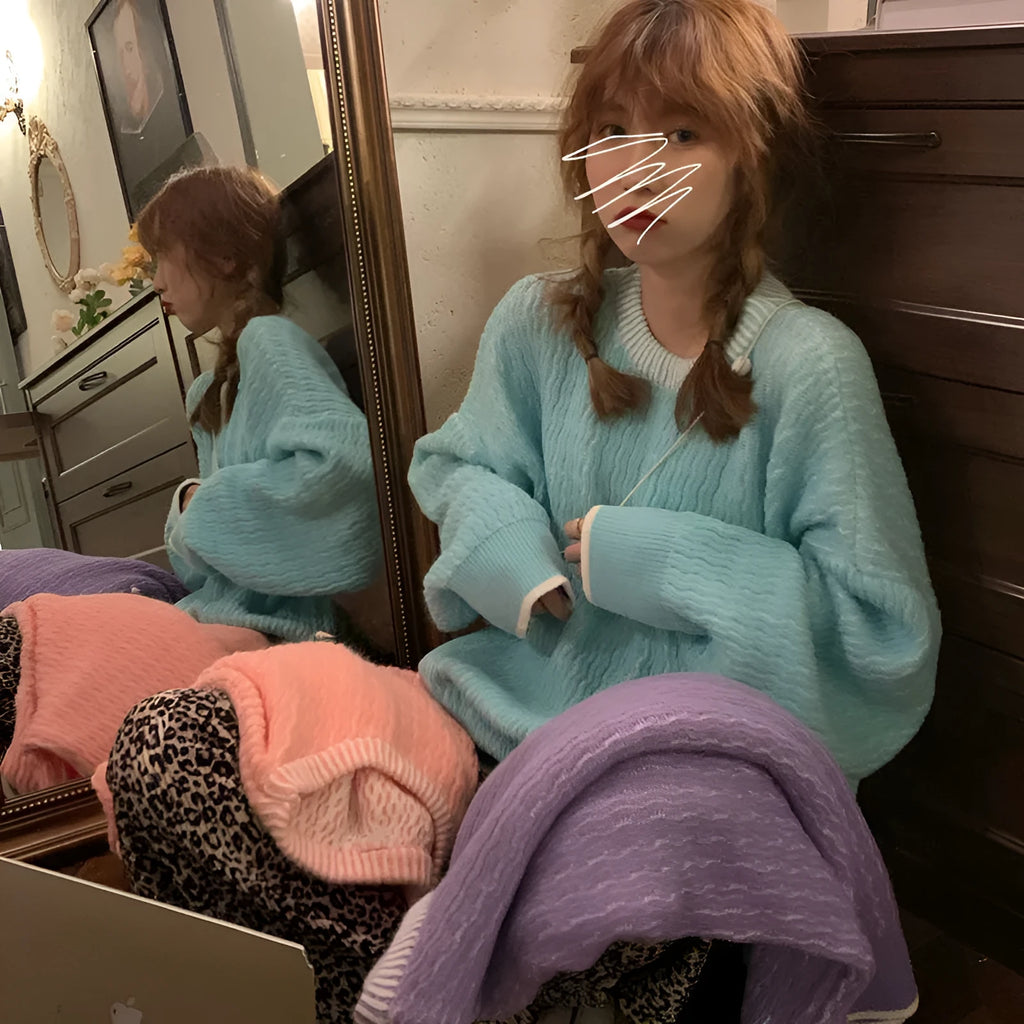 Women's loose solid colour polyester sweater in lake blue, shown on a hanger.