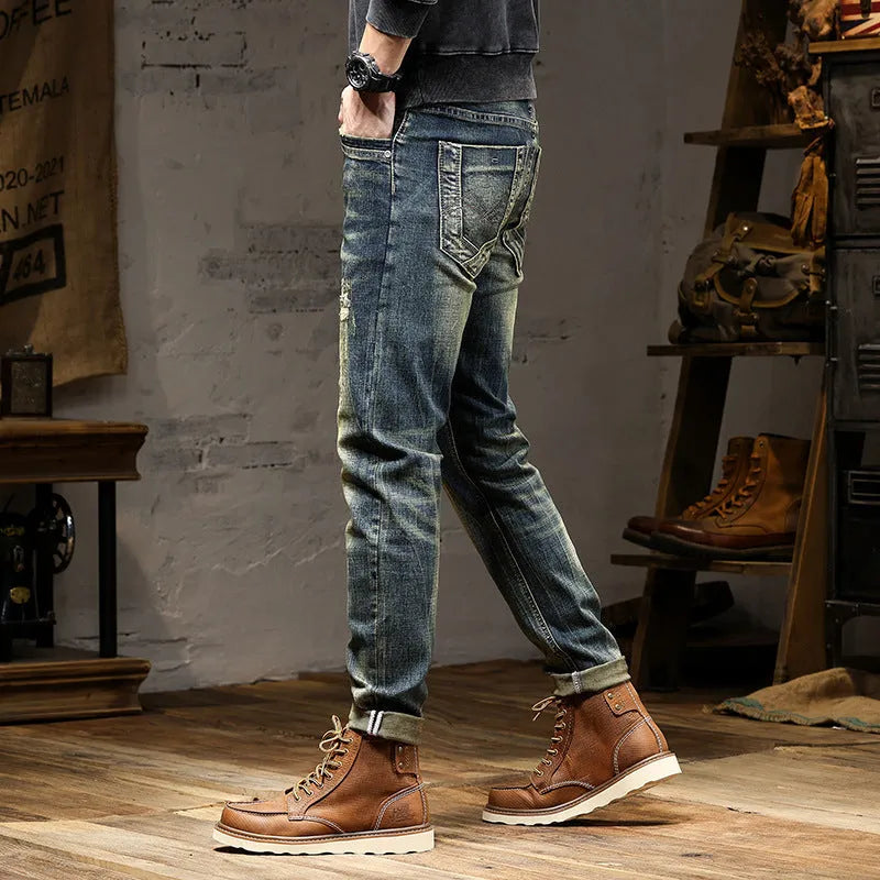 Men's retro colour skinny jeans with a zip fly, shown laid flat.