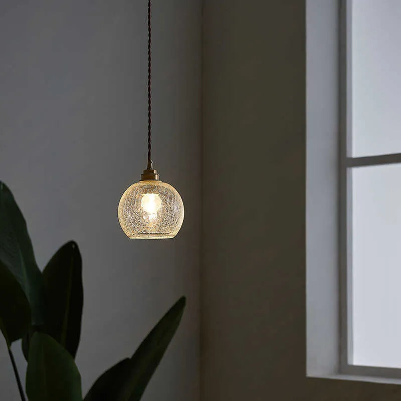Retro brass chandelier with glass ball shade measuring 17.5cm wide by 15cm high