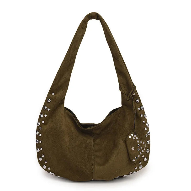 Soft plush casual tote handbag in a retro style, shown in a strapless underarm carry position.