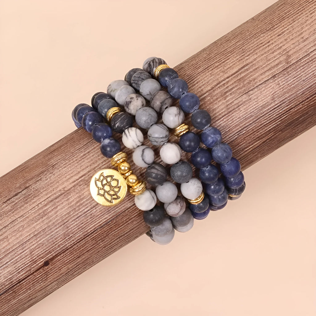 Blue patterned network stone beads on a multi-layer alloy bracelet in a natural style.