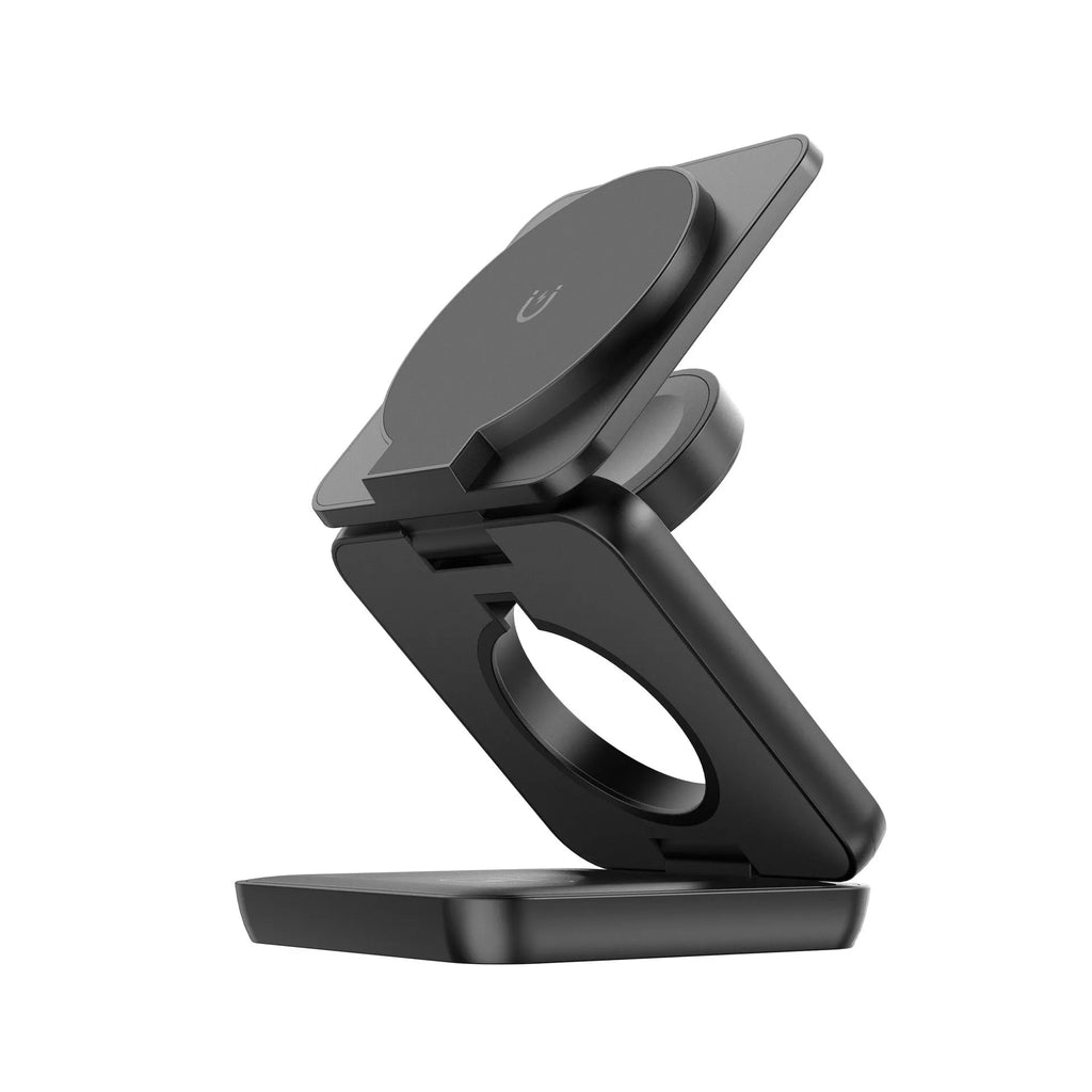 White foldable magnetic wireless phone charger holder with 360-degree rotating base on a desk.