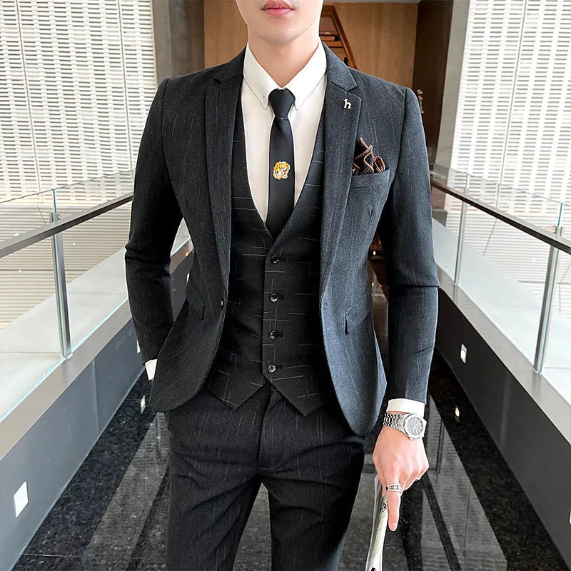 Slim fit men's business suit in black or dark grey cotton blend fabric with adhesive interlining construction