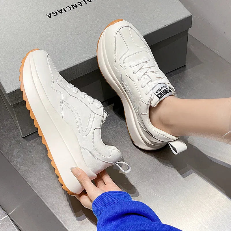 Beige women's low-top lace-up casual shoes with cowhide leather upper and cross strap detail.