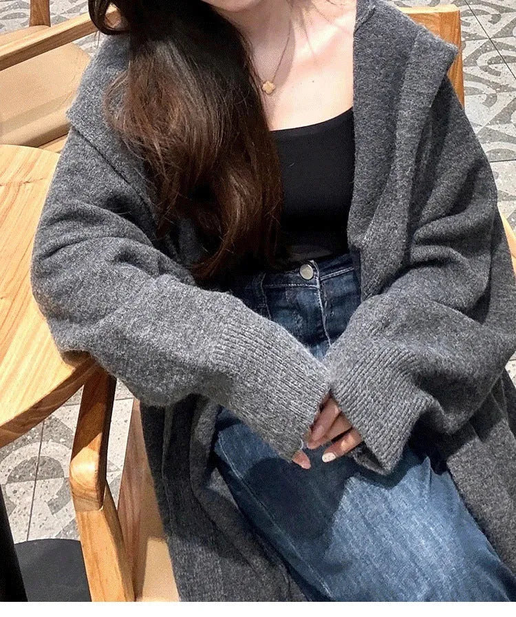 Korean style long hooded cardigan for women in oatmeal colour, showing below-the-knee length and loose fit.