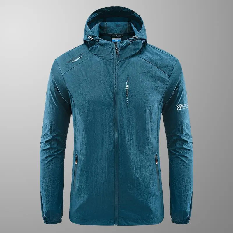 Man wearing a lightweight grey hooded summer jacket made from thin nylon fabric.