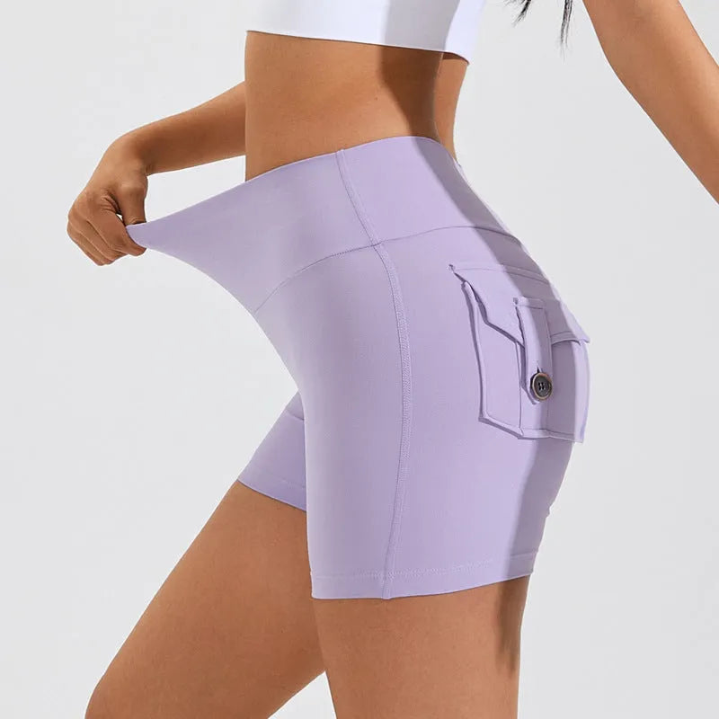 Women's high waist nylon fitness shorts with pockets in avocado green colour.