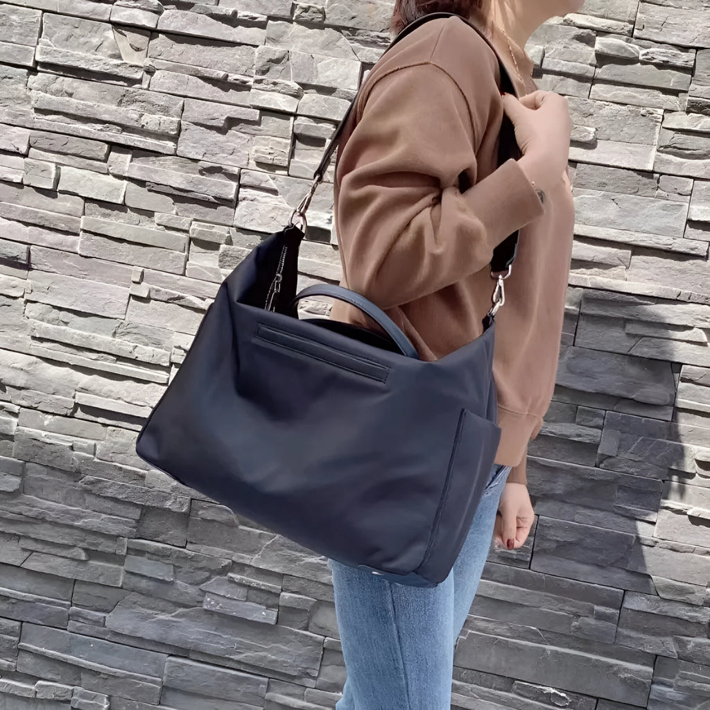 Nylon waterproof cloth shoulder bag in black or light khaki with 35cm length and polyester lining