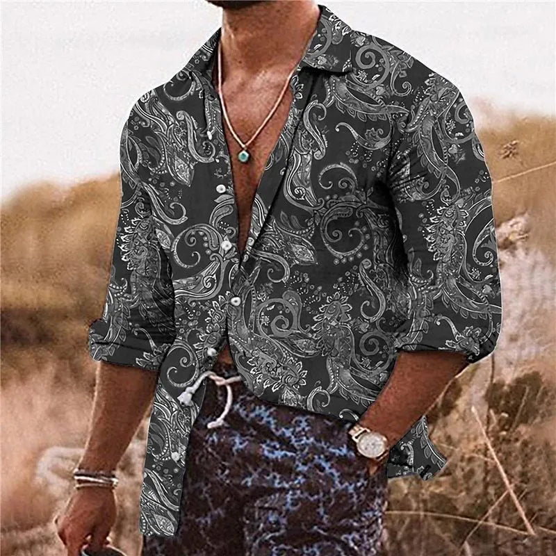 Man wearing a loose fit long sleeve shirt with a colourful 3D digital printed floral bohemian pattern.