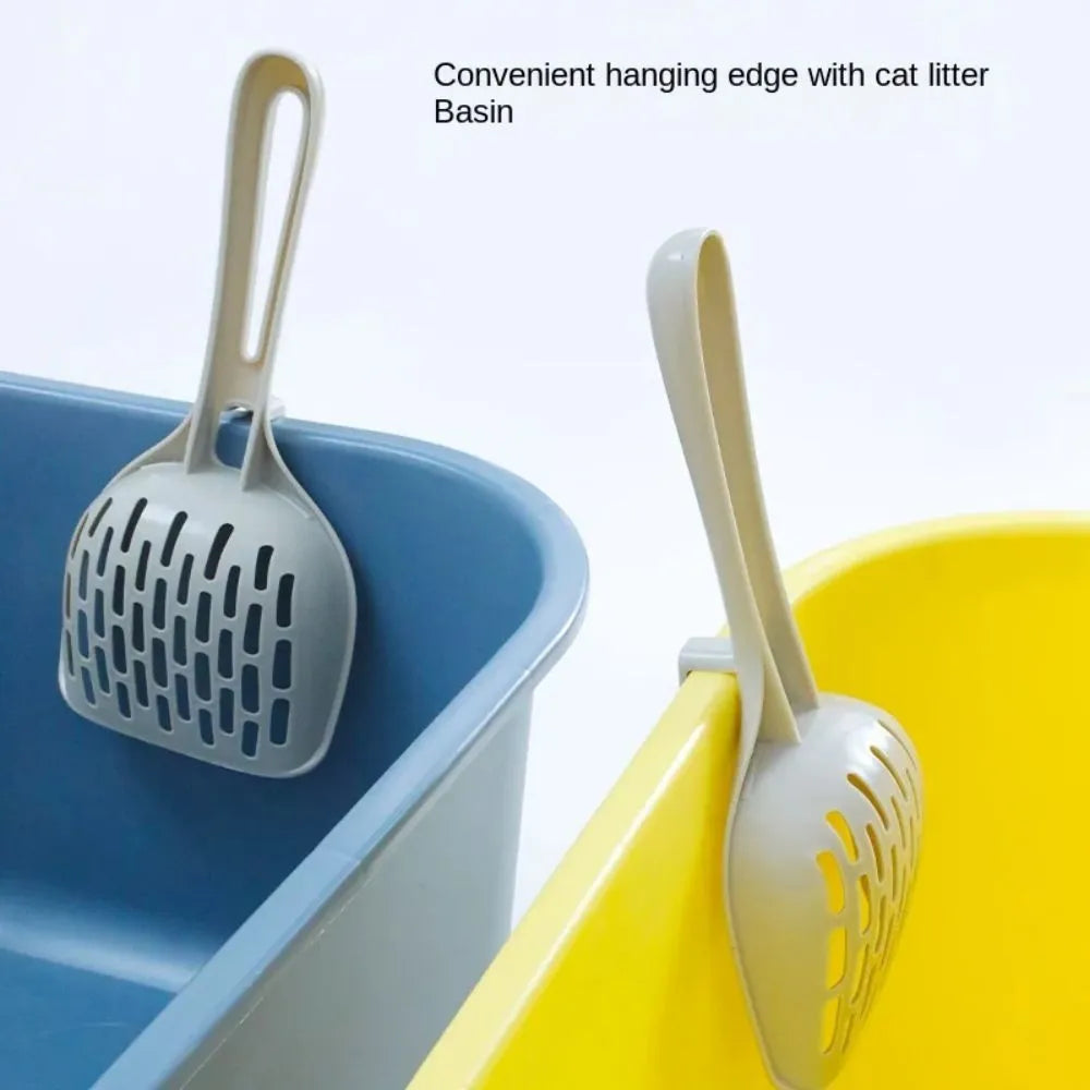 Grey plastic cat litter scoop with an attached base and a handle.