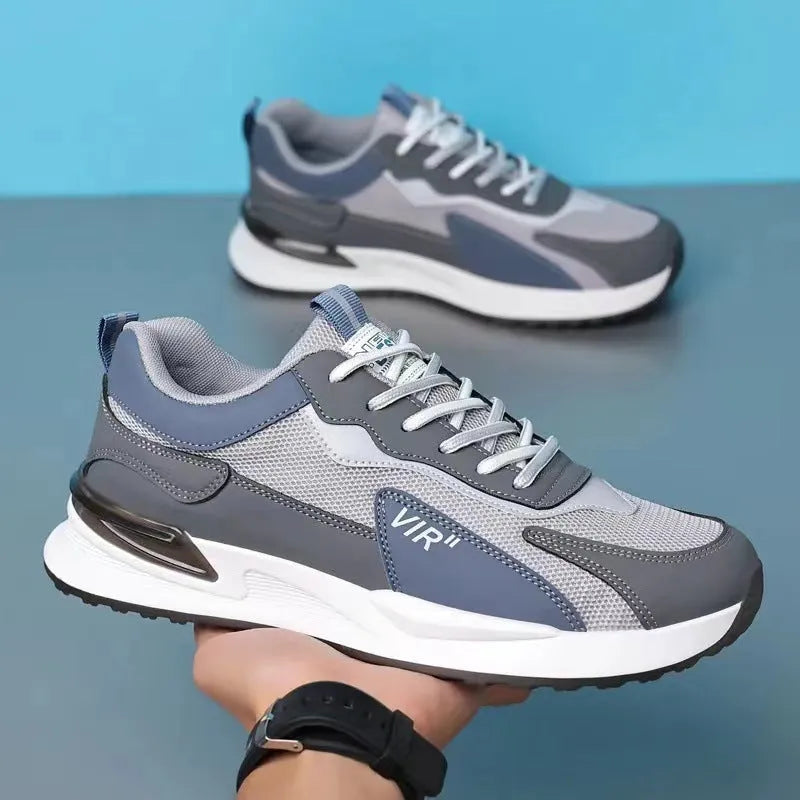 Men's colour block mesh sneakers in grey with lace-up front and low-top design.