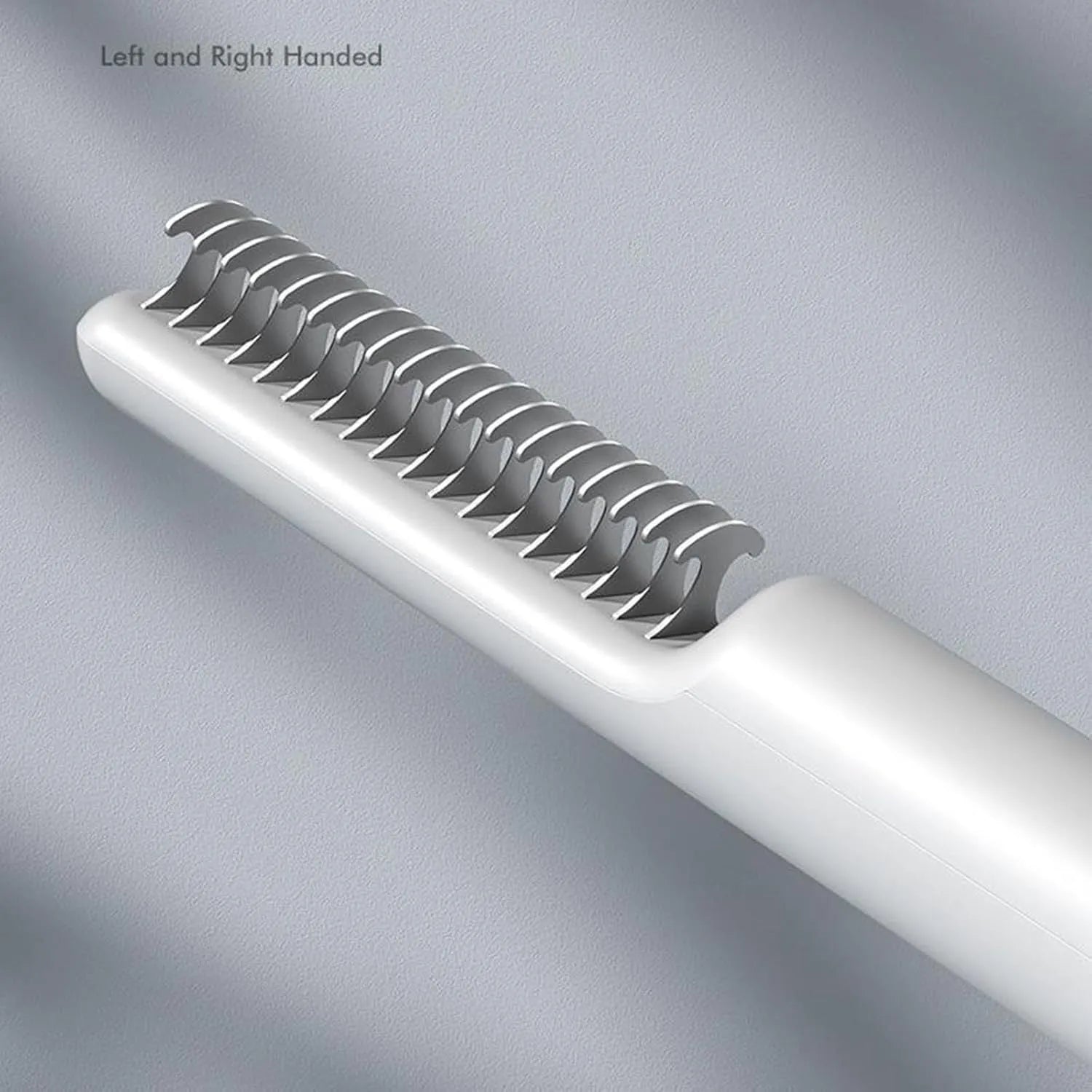 Stainless steel pet dematting comb with user-friendly handle on a pink background.