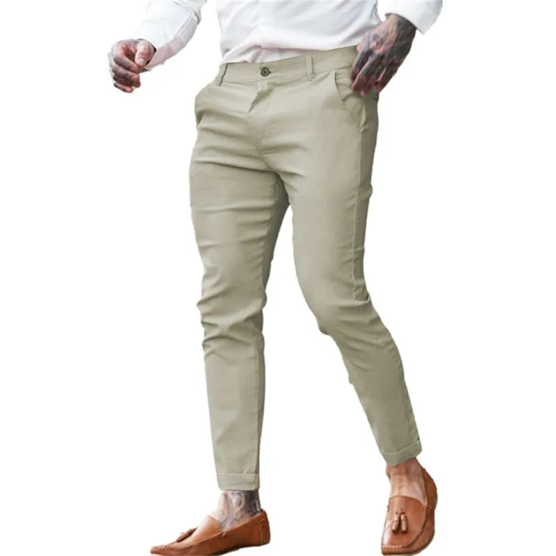 Men's slim-fit pencil trousers in stretch cotton twill fabric, shown in a dark blue colour.