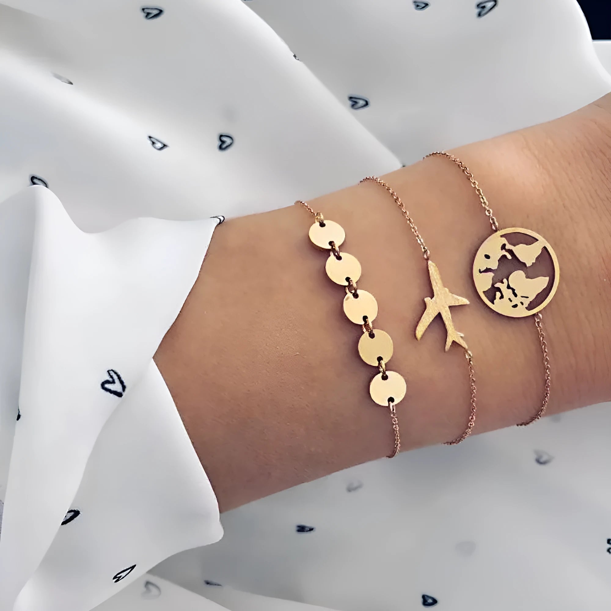 Three bohemian bracelets with heart-shaped aircraft map charms in alloy with electroplated finish