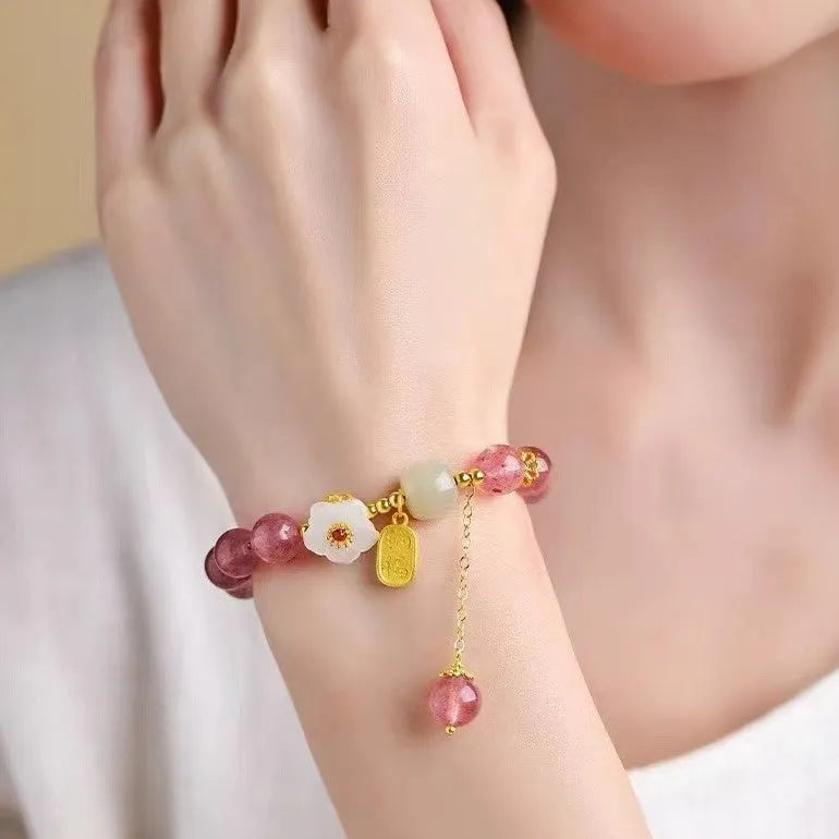 Handmade Hetian jade peach blossom strawberry quartz crystal bracelet for women showing strawberry quartz pearl and charm details