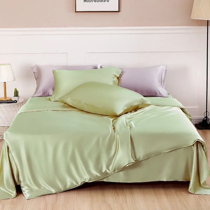 Double-sided silk duvet cover in solid colours showing lotus pink, pea green, and bright brown options