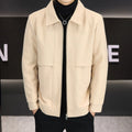 Man wearing a khaki polo collar casual jacket with side seam pockets.
