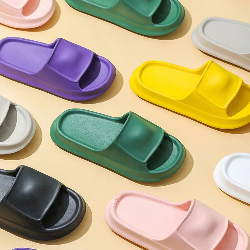 Thickened EVA flip-flop slippers in multiple colours showing the sole thickness.