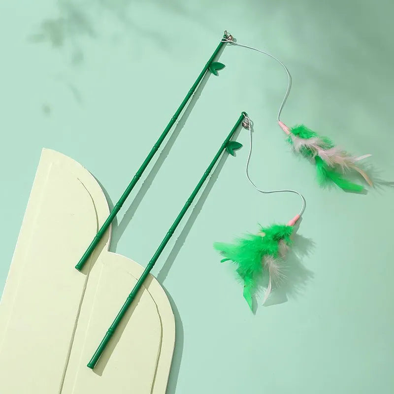 Green interactive cat wand toy with feather and bell refills for feline play