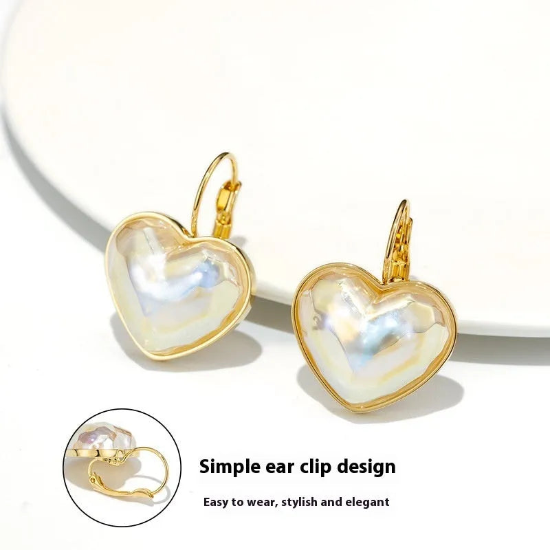 A pair of gold-coloured alloy clip-on earrings for women with a natural style.