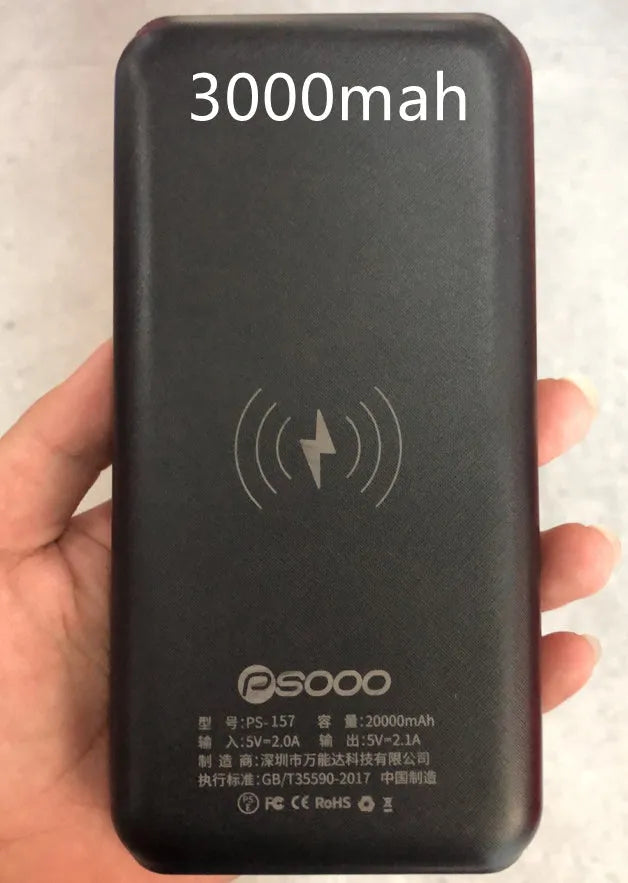 Portable power bank with wireless charging surface and USB ports in black colour