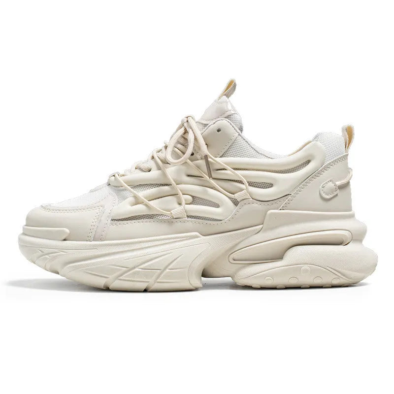 Men's beige and black low-top sneakers with mesh lining, lace-up front, and rubber platform soles