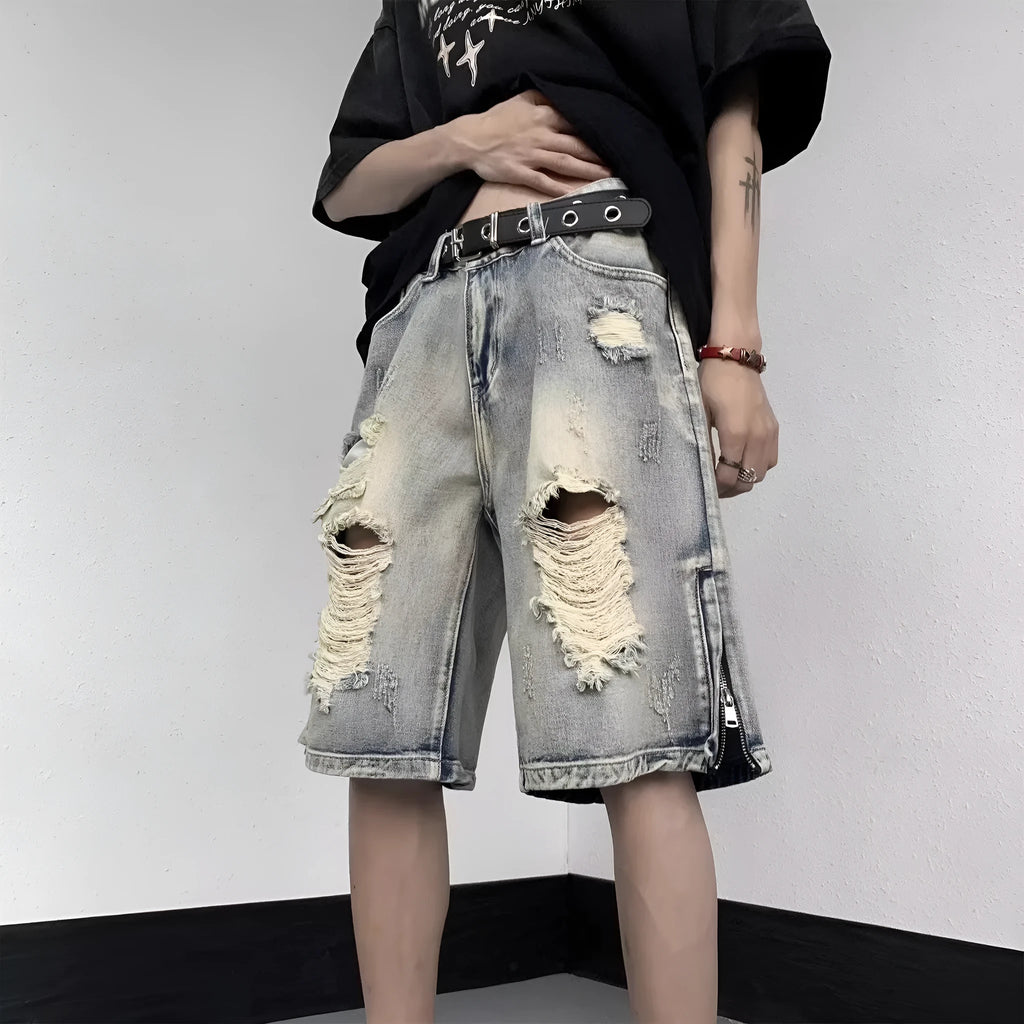 Blue retro-style women's denim shorts with wide leg, loose fit, and tattered detailing on a neutral background.