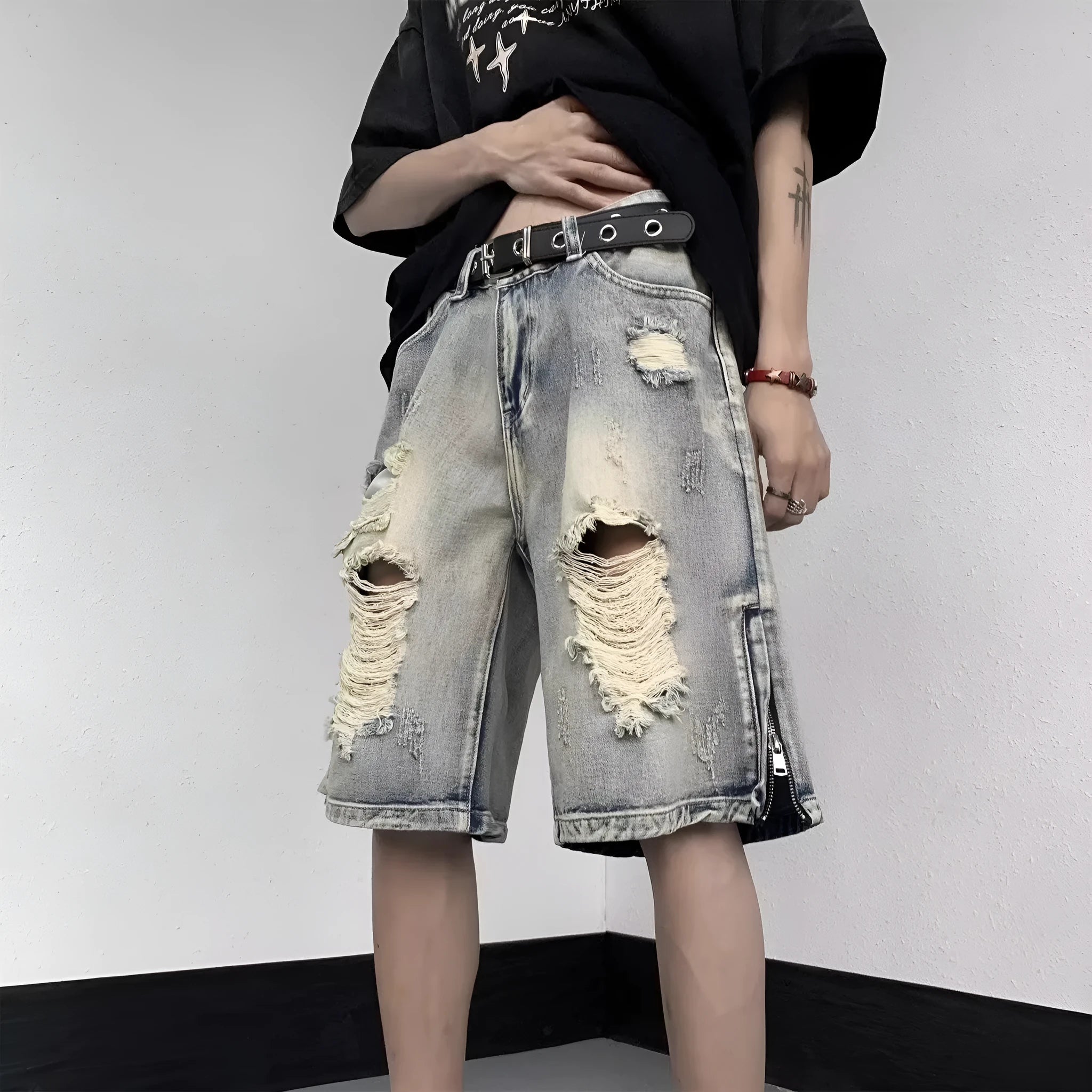Blue retro-style women's denim shorts with wide leg, loose fit, and tattered detailing on a neutral background.