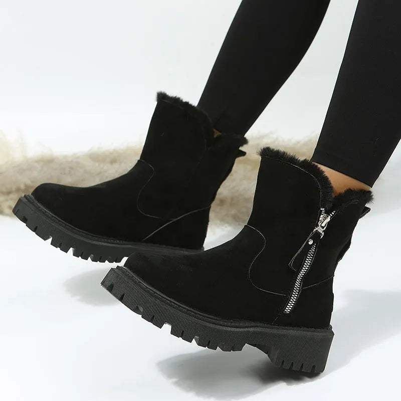Women's black high-top faux suede snow boot with side zipper and non-slip sole.