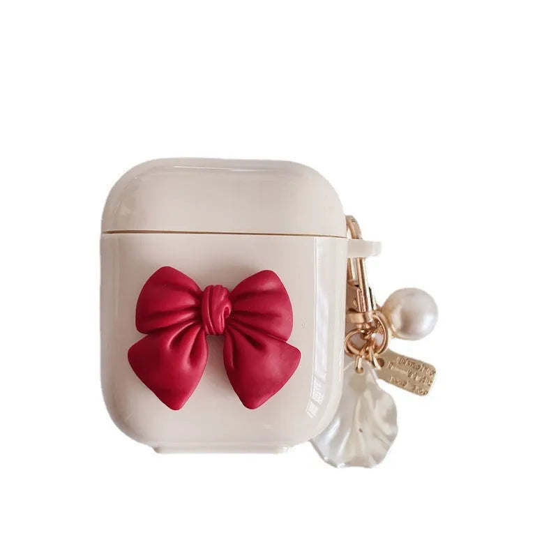 Beige red bow shell TPU AirPods case with clamshell opening design