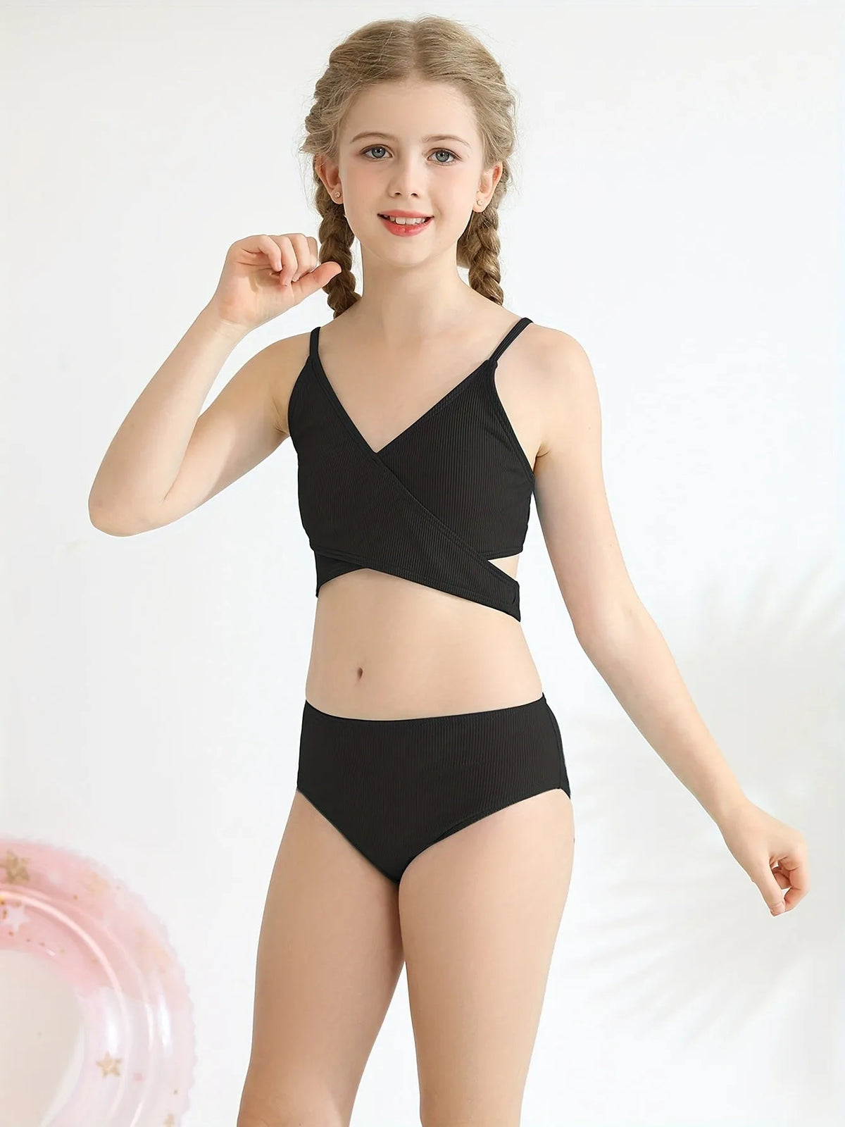 Girls two piece swimsuit set with criss cross top and swimming trunks, polypropylene fibre, available in seven colours and sizes 9-10Y to 15-16Y.