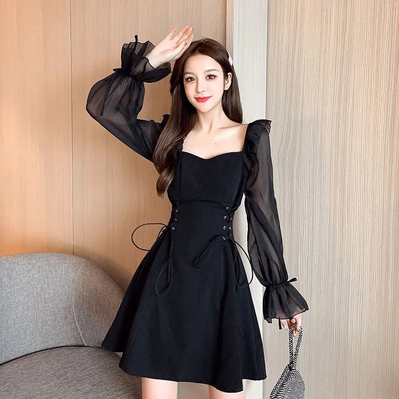 White chiffon patchwork waist-slimming dress with long sleeves and skirt on mannequin