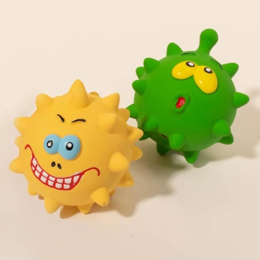 Set of four colourful natural latex rubber dog balls with cute faces and bumpy texture