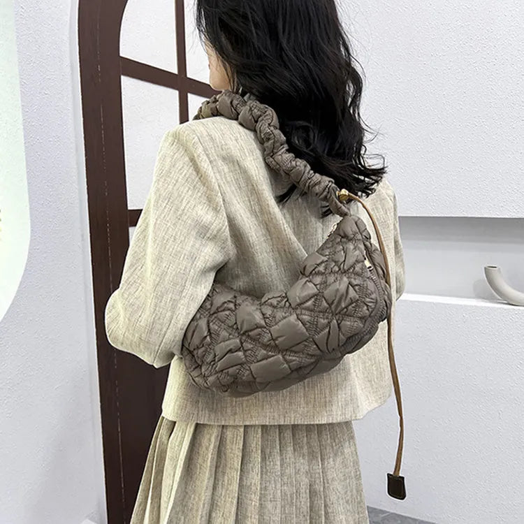 Women's light beige nylon messenger bag with long shoulder strap, shown with dimensions 35cm wide by 20cm high.