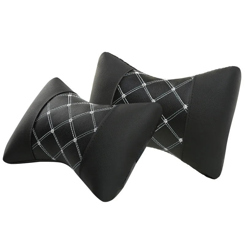 Black diamond quilted car headrest pillow with contrast stitching for neck and cervical support.
