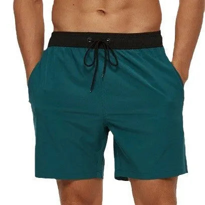 Men's blue athletic shorts with stitching waistband headband pocket and drawstring closure