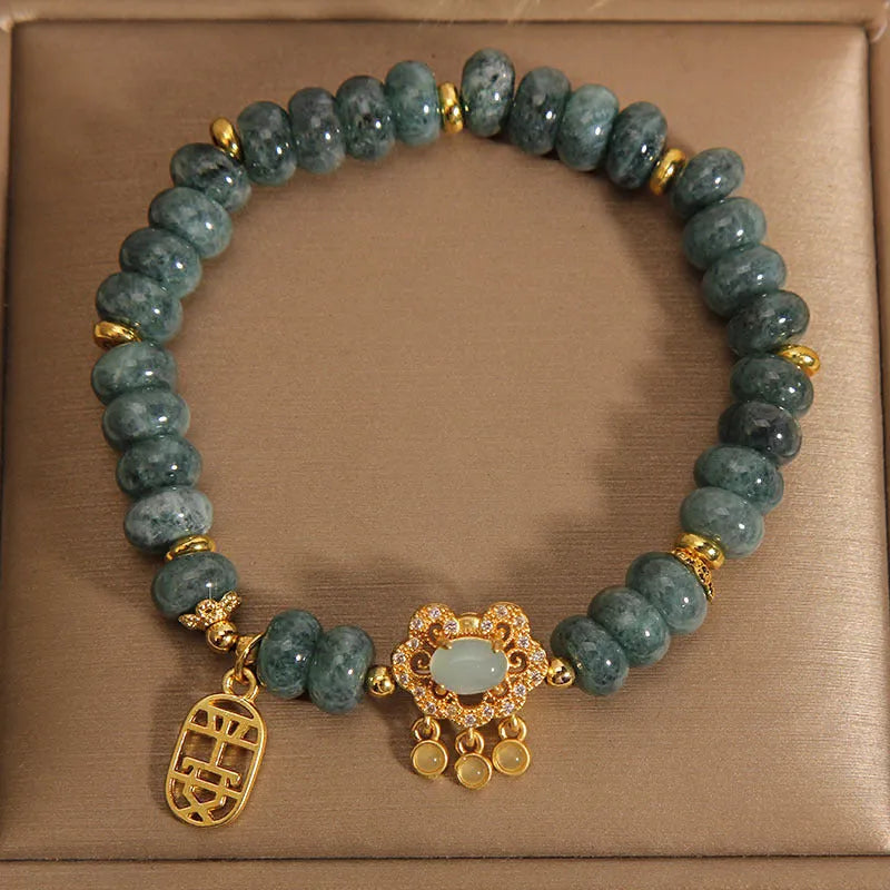 Women's bracelet with natural emerald jade abacus beads and alloy safety lock closure