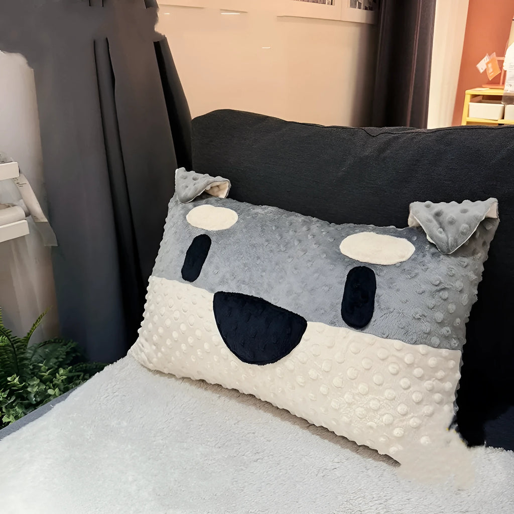 West Highland Terrier shaped decorative cushion pillow on a sofa.