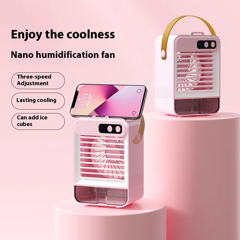 Compact dark green and ivory white USB-powered desktop air humidifier with digital display on a wooden desk.