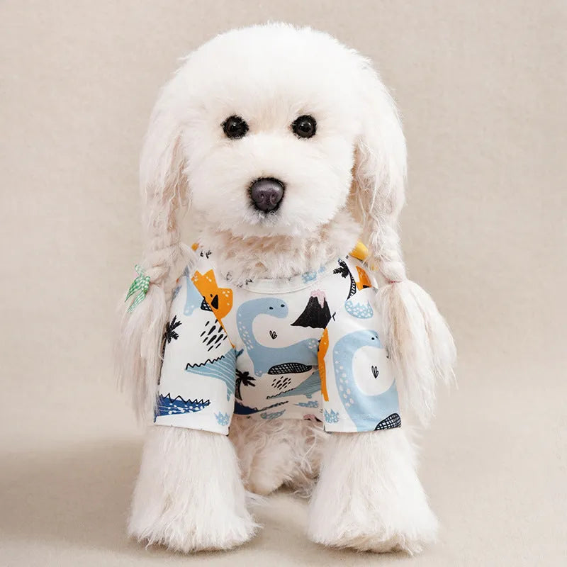 A small dog wearing a colourful printed polyester t-shirt, showing the casual spring and autumn pet clothing.