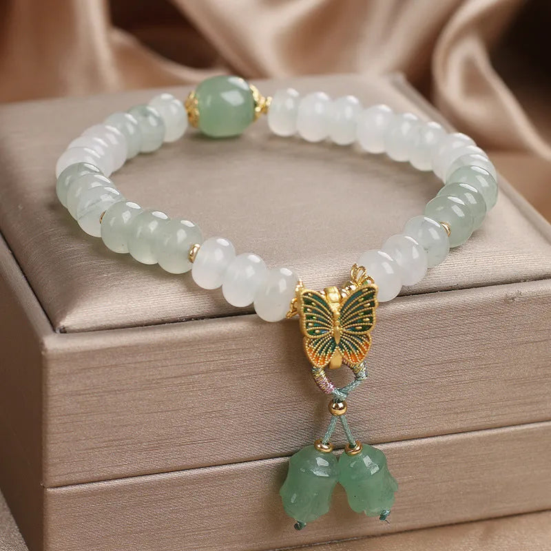 Green retro butterfly tassel bracelet with crystal beads, pearls, and rhinestones