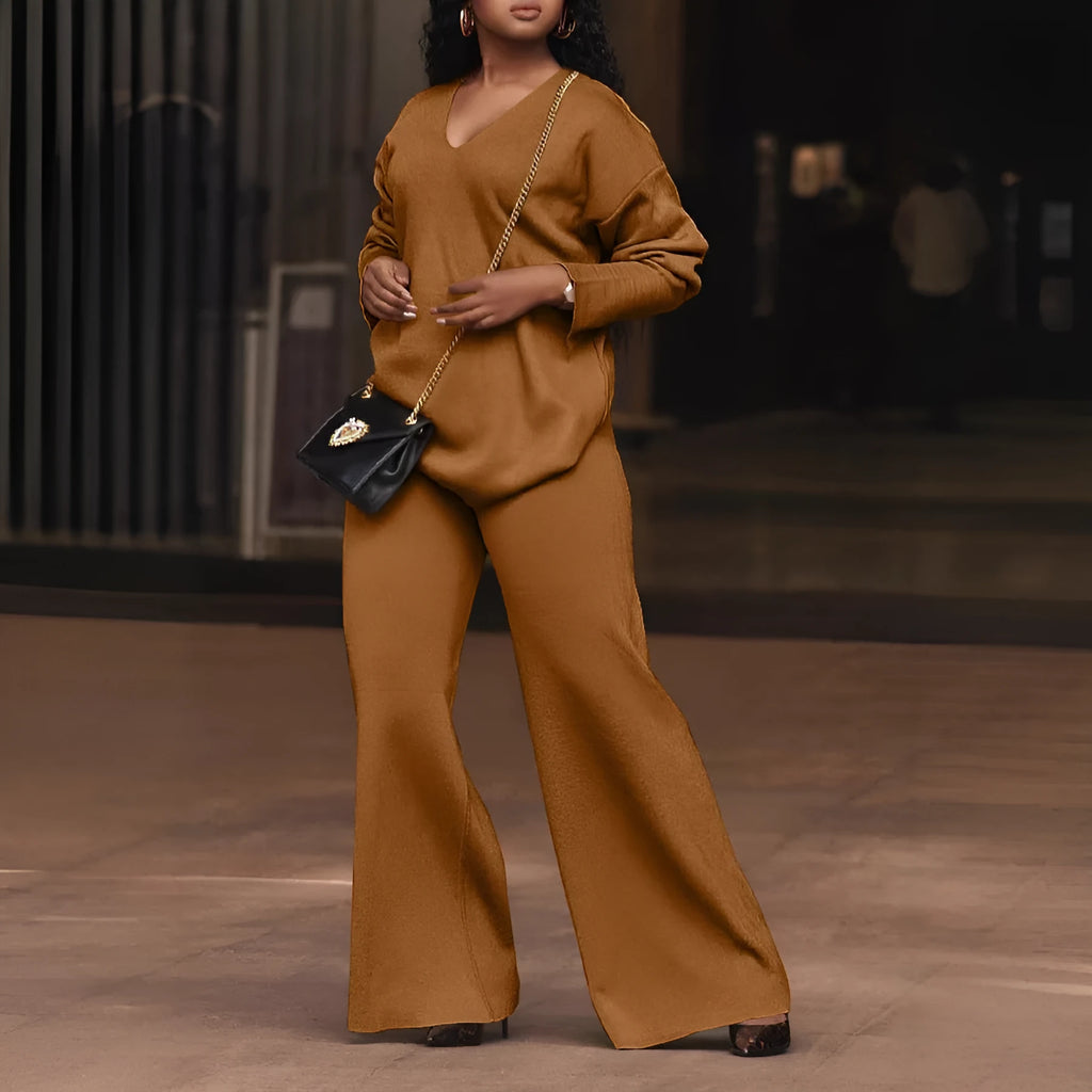 Brown women's long-sleeve suede top and trousers two-piece casual suit on a hanger.