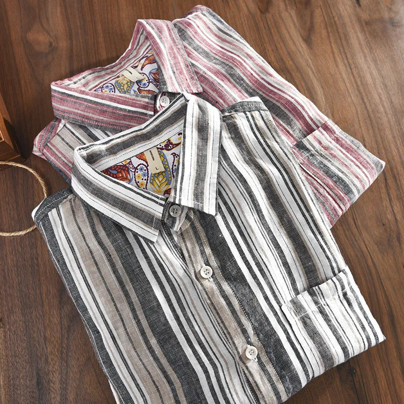 Grey striped linen shirt with long sleeves on male model showing loose casual fit