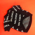 Acrylic pullover dog sweater in black or green, sizes S to 2XL, with neck, bust, and back length measurements.