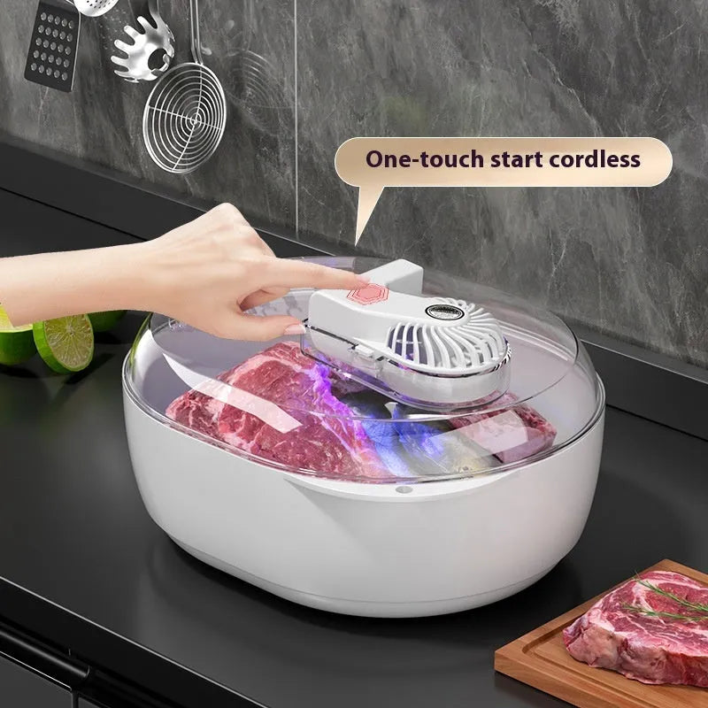 Aluminium household food defrosting plate with USB cable on a kitchen countertop.