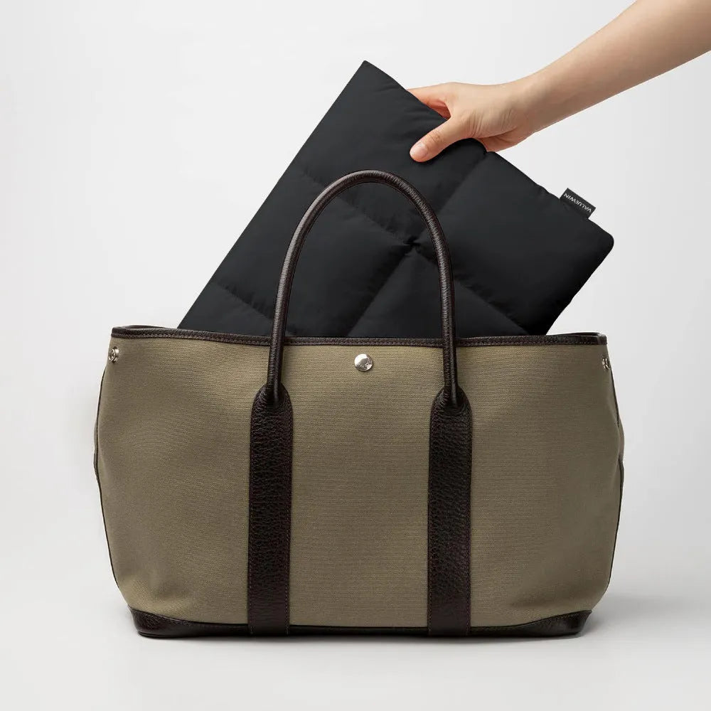 Soft fluffy polyester laptop sleeve in black or khaki for 13 to 15.6 inch laptops.